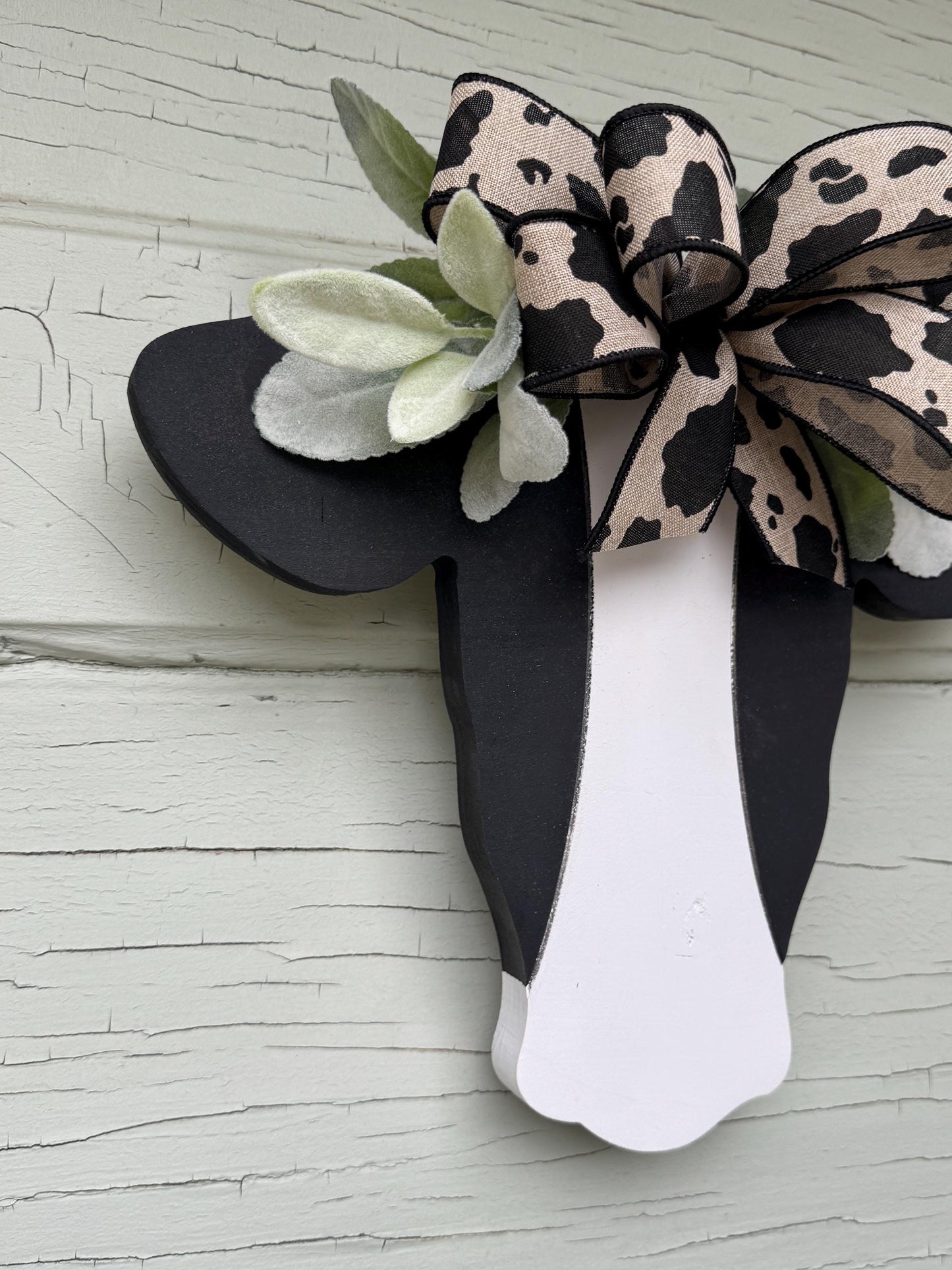 Wooden Cow Head with greenery and bow