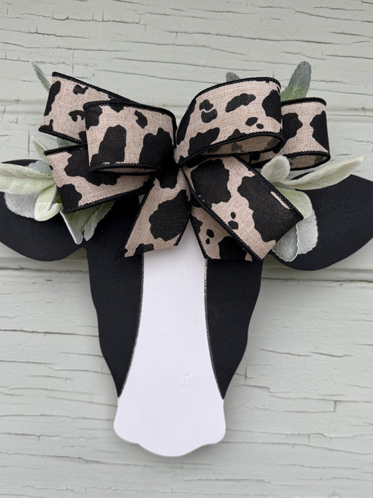 Wooden Cow Head with greenery and bow