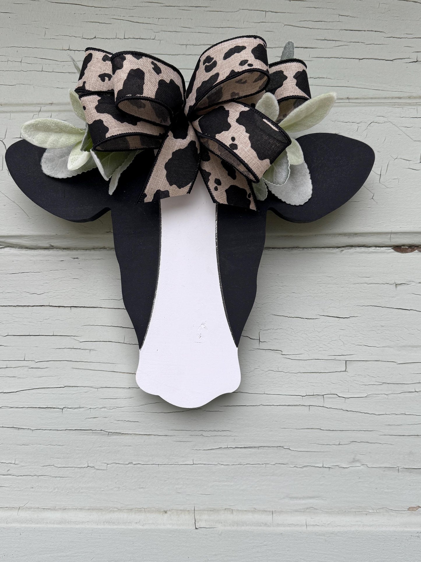 Wooden Cow Head with greenery and bow